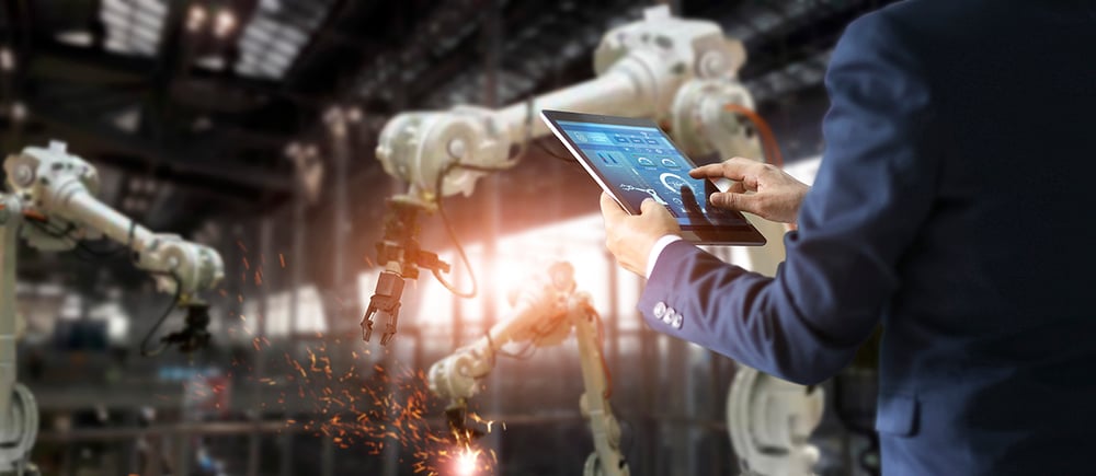 manager-industrial-engineer-using-tablet-check-and-control-automation-robot-arms-machine(1)