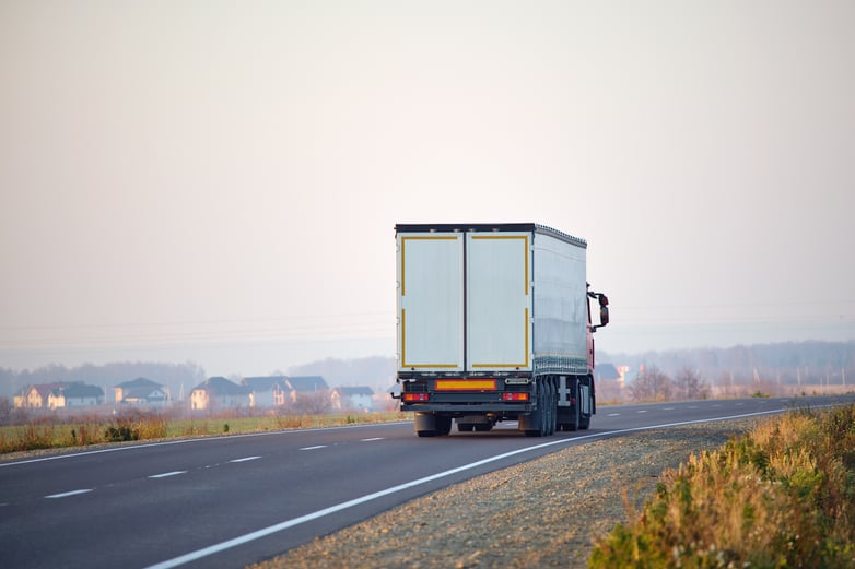 semi-truck-with-cargo-trailer-driving-on-highway-h-2024-12-06-04-07-12-utc