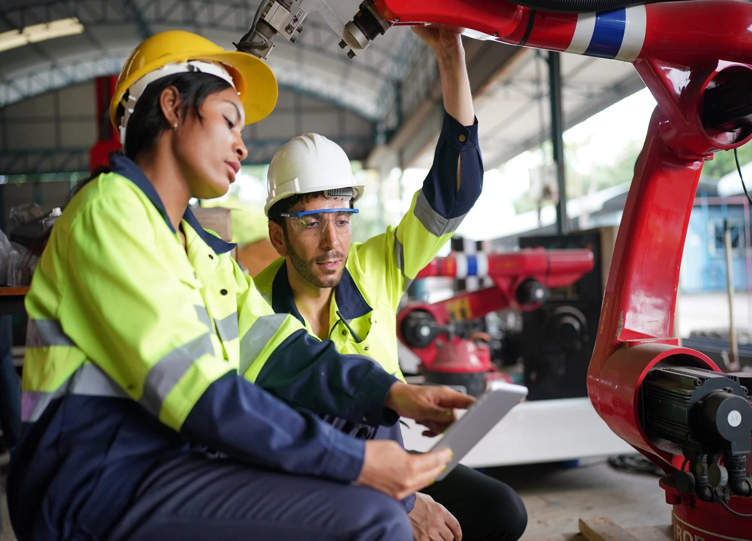 Two maintenance technicians performing inspection with the help of a maintenance software